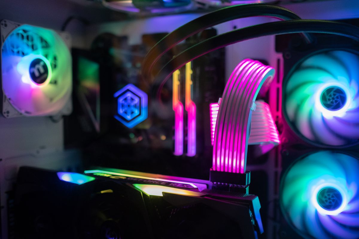Close-up of a custom RGB gaming PC with liquid cooling and graphics card