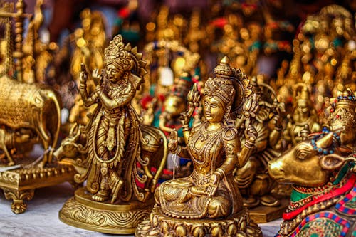 Gold Hindu Deity Figurine in Close Up Shot