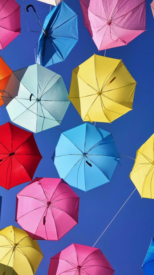 Colorful Umbrellas Under Blue Sky