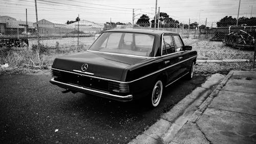 A Grayscale Photo of a Vintage Car