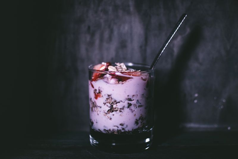 layered yogurt parfait with granola and berries