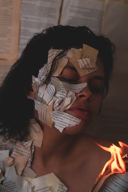 Woman with Burning Papers on Body