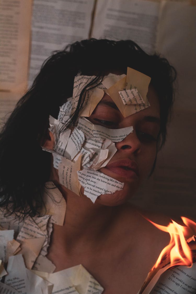 Woman With Burning Papers On Body