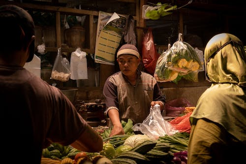 Free A Merchant Selling Vegetables Stock Photo