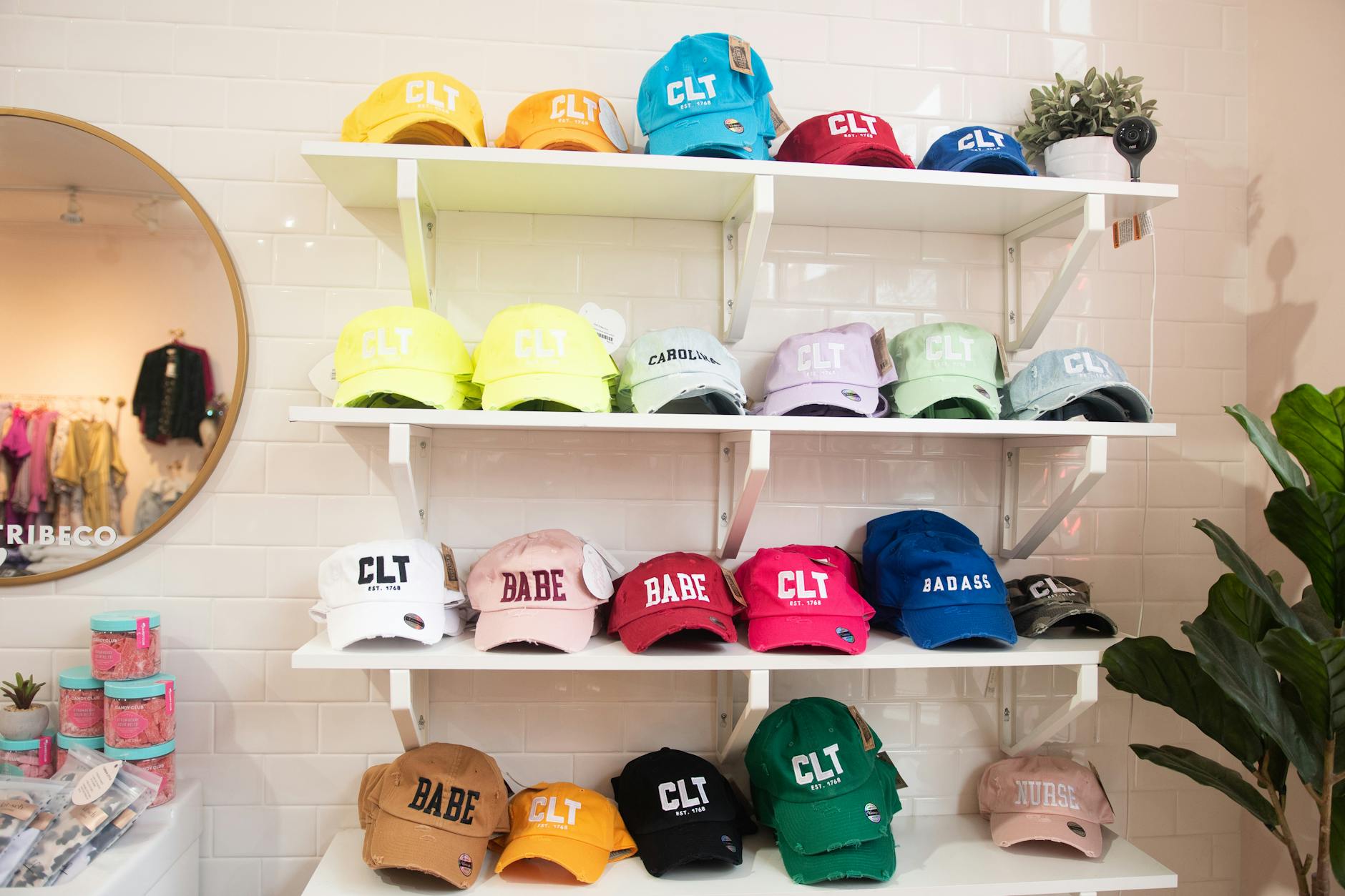 A vibrant array of baseball caps on display in a Charlotte boutique.