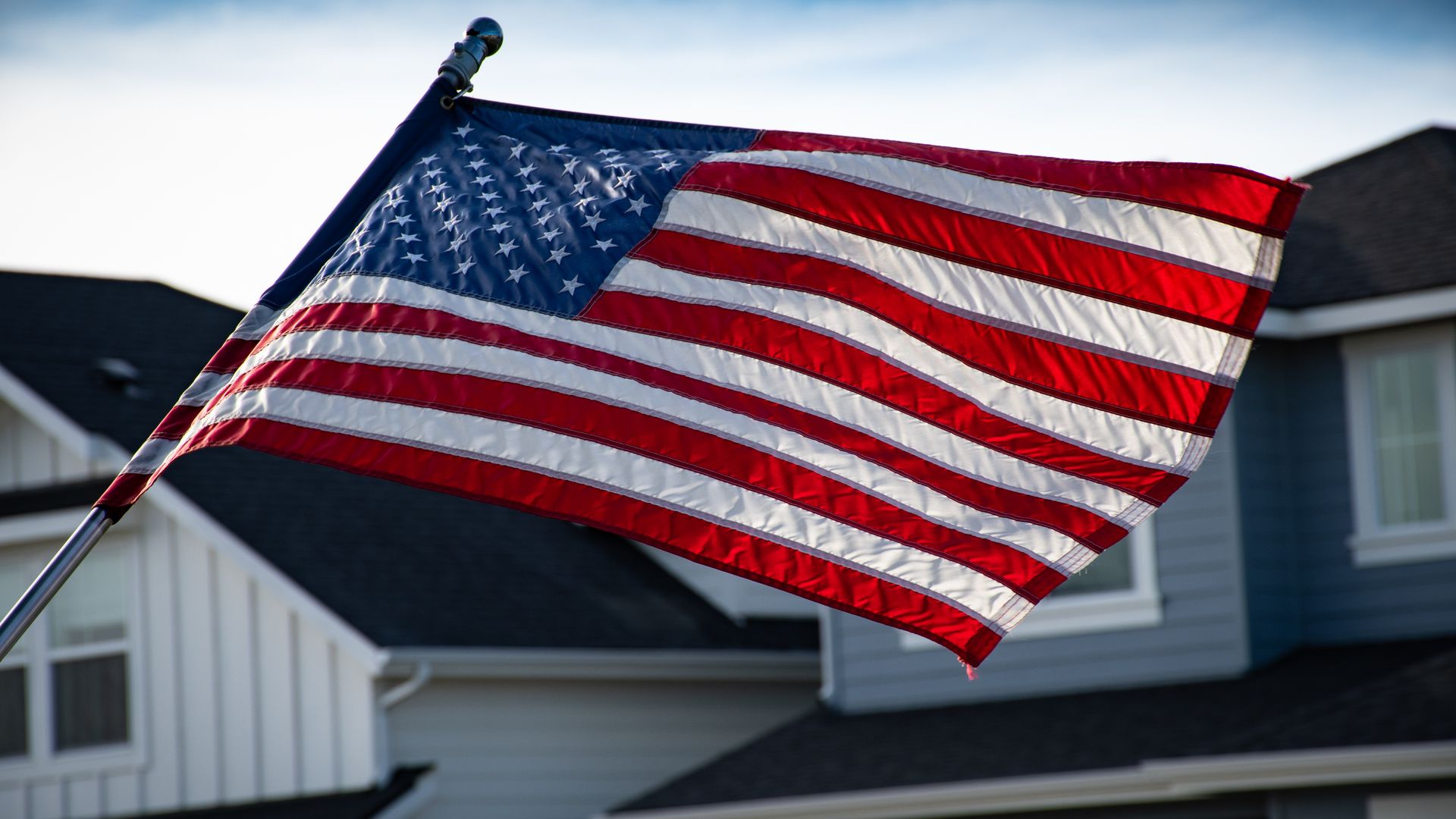 American flag near a home in a military community