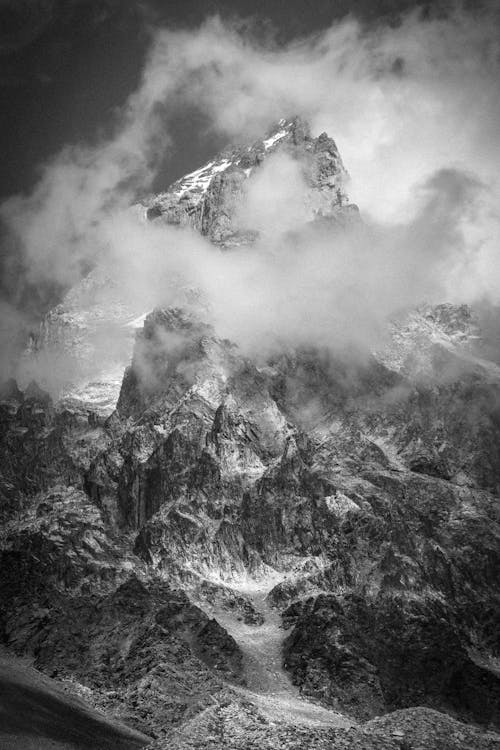 Grayscale Photography of Mountain Covered with Snow