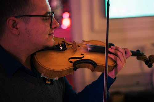 Man Playing Violin in the Room
