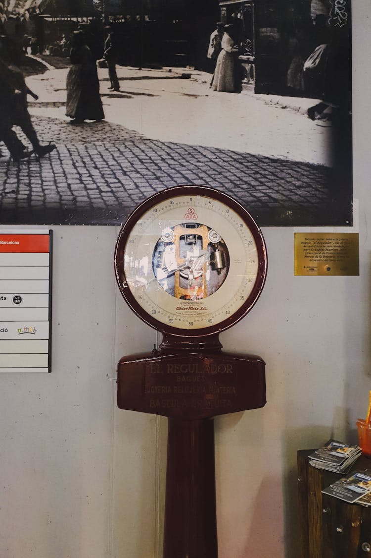 Vintage Weighing Scale Beside A Wall