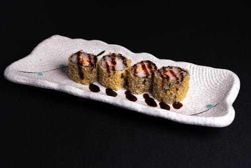 Sushi Roll on White Ceramic Plate