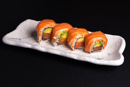 Sushi Roll on White Ceramic Plate