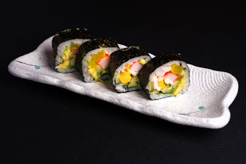 Sushi Roll on White Ceramic Plate