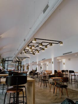 Spacious modern cafe in Istanbul, featuring stylish furniture and elegant lighting.