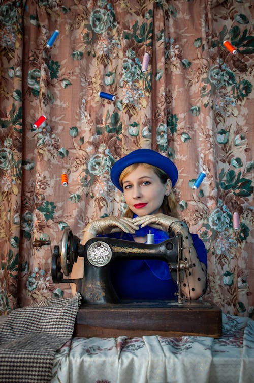 Woman Sitting at the Sewing Machine