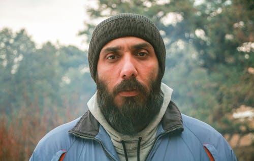 Bearded Man in Blue Jacket and Knit Cap