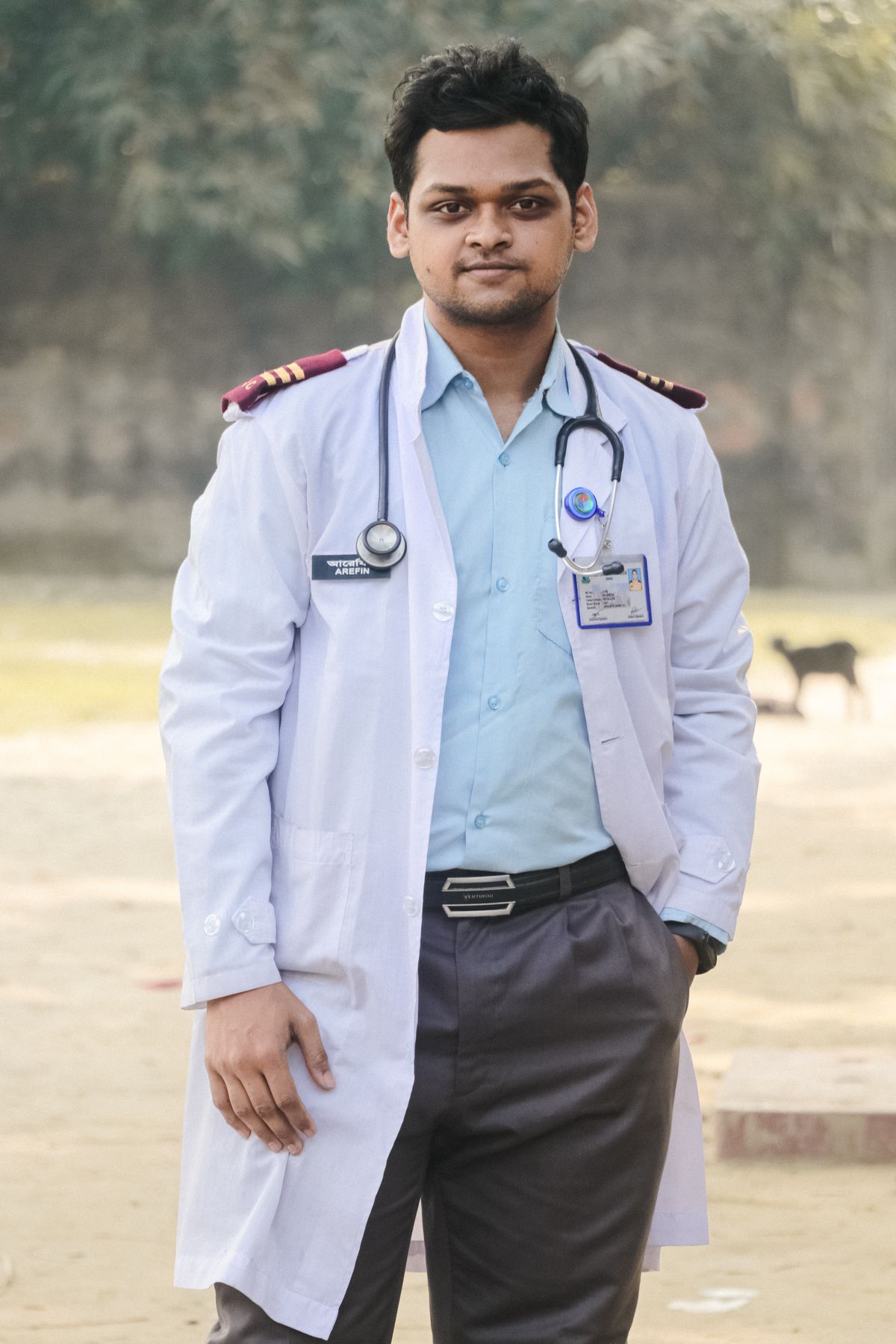 Portrait of a South Asian doctor standing outdoors with a stethoscope