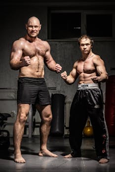Two athletic men striking poses in a well-equipped gym setting, showcasing fitness and strength.