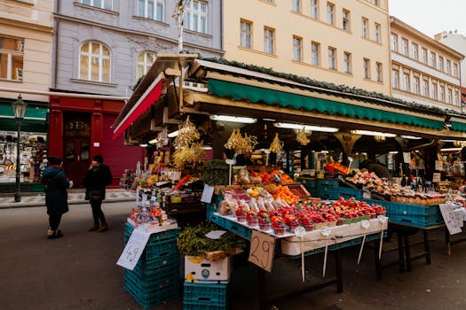 Explore a lively outdoor market stall with assorted fruits and vegetables, perfect for a local shopping experience.