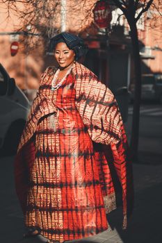 Smiling Woman in Traditional Clothes on Street