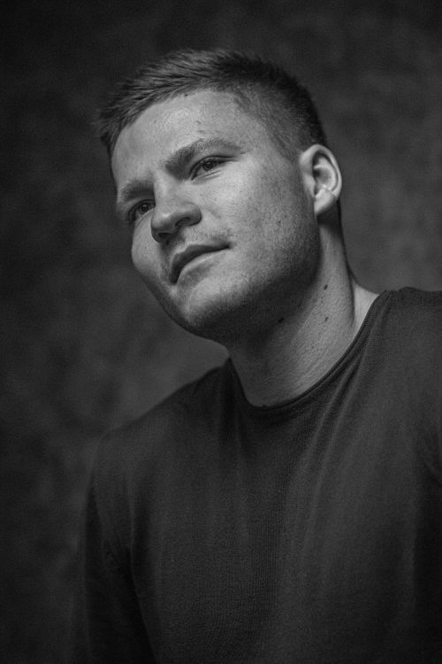 Free Monochrome portrait of a man with a pensive expression. Captures depth and character. Stock Photo
