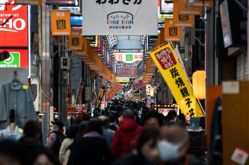 Free A vibrant and crowded street scene in Dotonbori, Osaka, Japan showcasing signs, shops, and people. Stock Photo