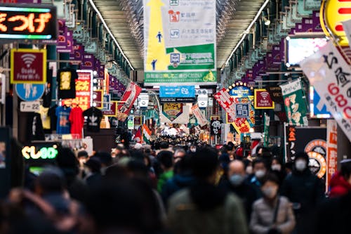 Crowd of People Walking on a  Busy Street