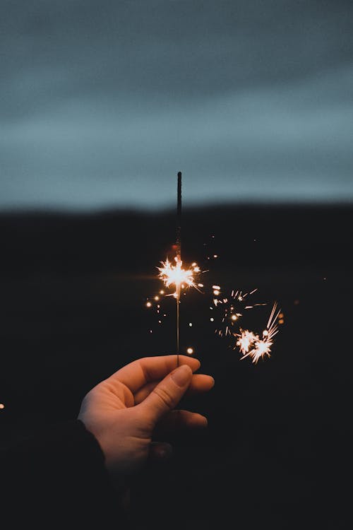 Hand Holding Sparklers