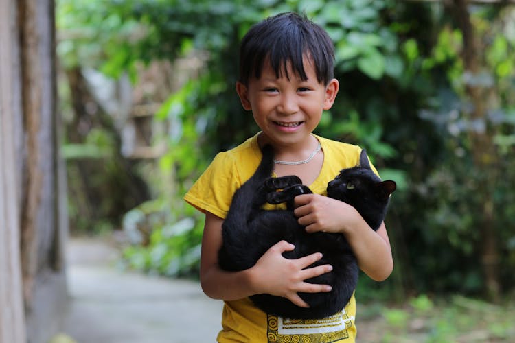 Smiling Boy With Cat