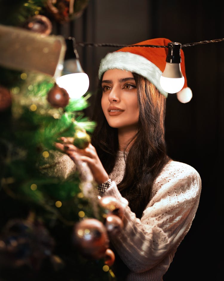 Woman Decorating Christmas Tree