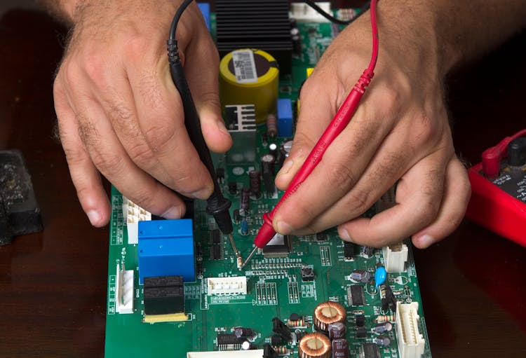 Man Hands Working On Computer Motherboard