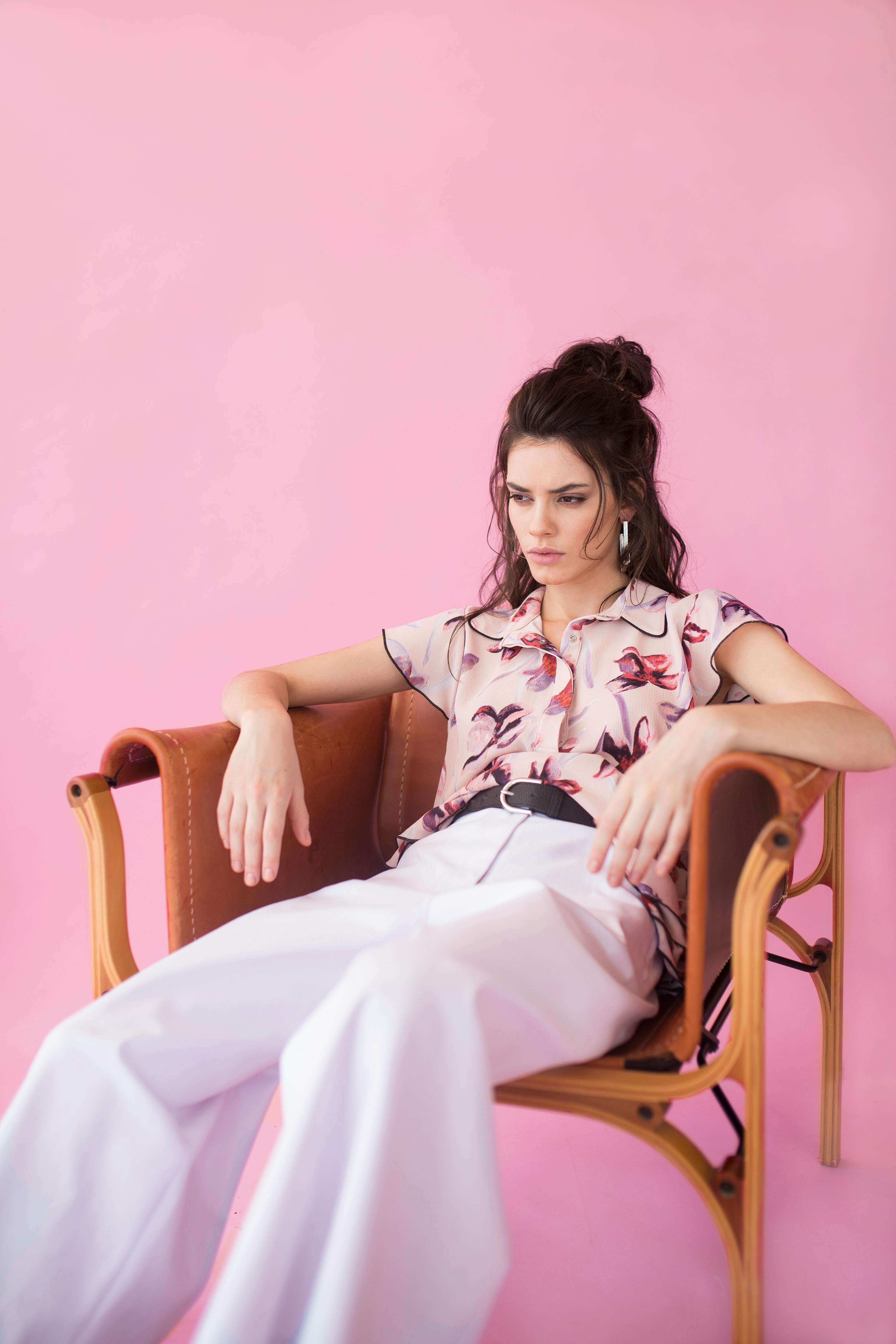 Photography of a Woman Sitting on Chair