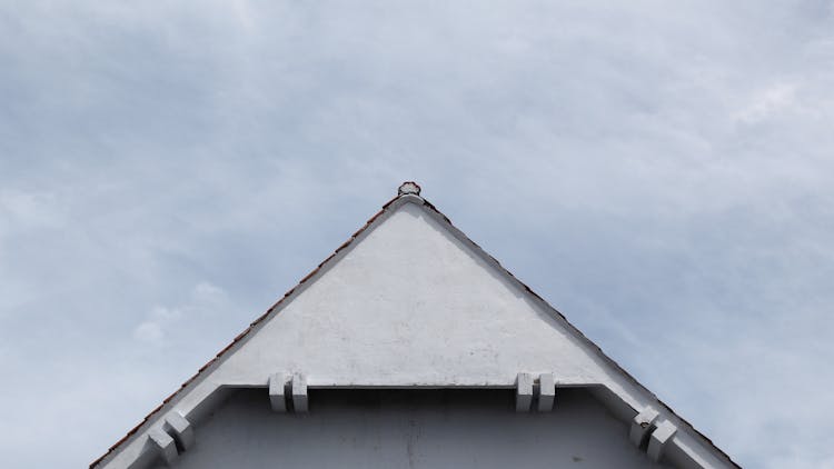 House Roof On Blue Sky Background