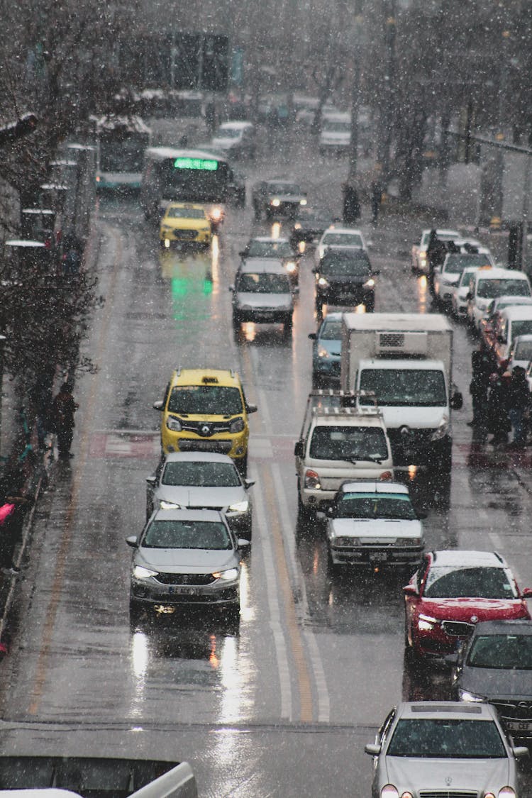 Cars Driving On Road In Snow