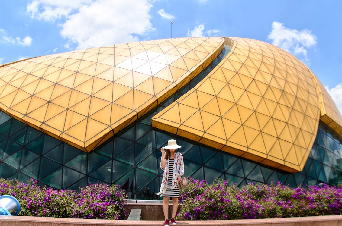 Free Woman Standing Near Dome Building Stock Photo