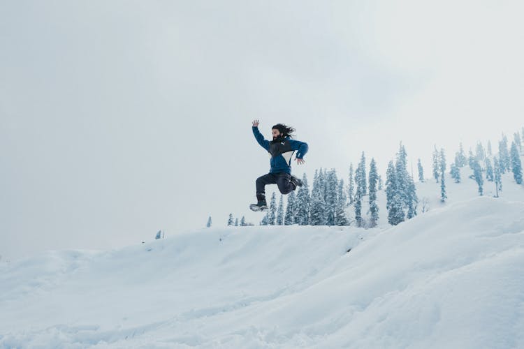 Man Jumping In Snow