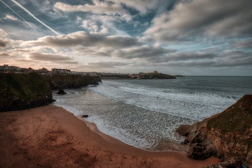 Clouds over Beach near Town on Cliffs