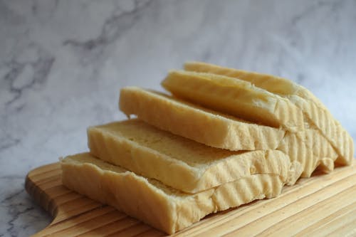 Free Sliced Loaf Bread on Chopping Boar Stock Photo