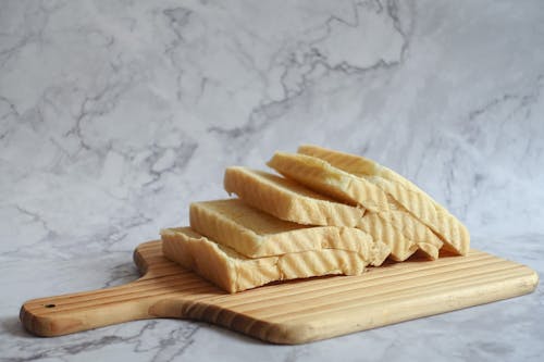 Free Slice Bread on Brown Chopping Board Stock Photo