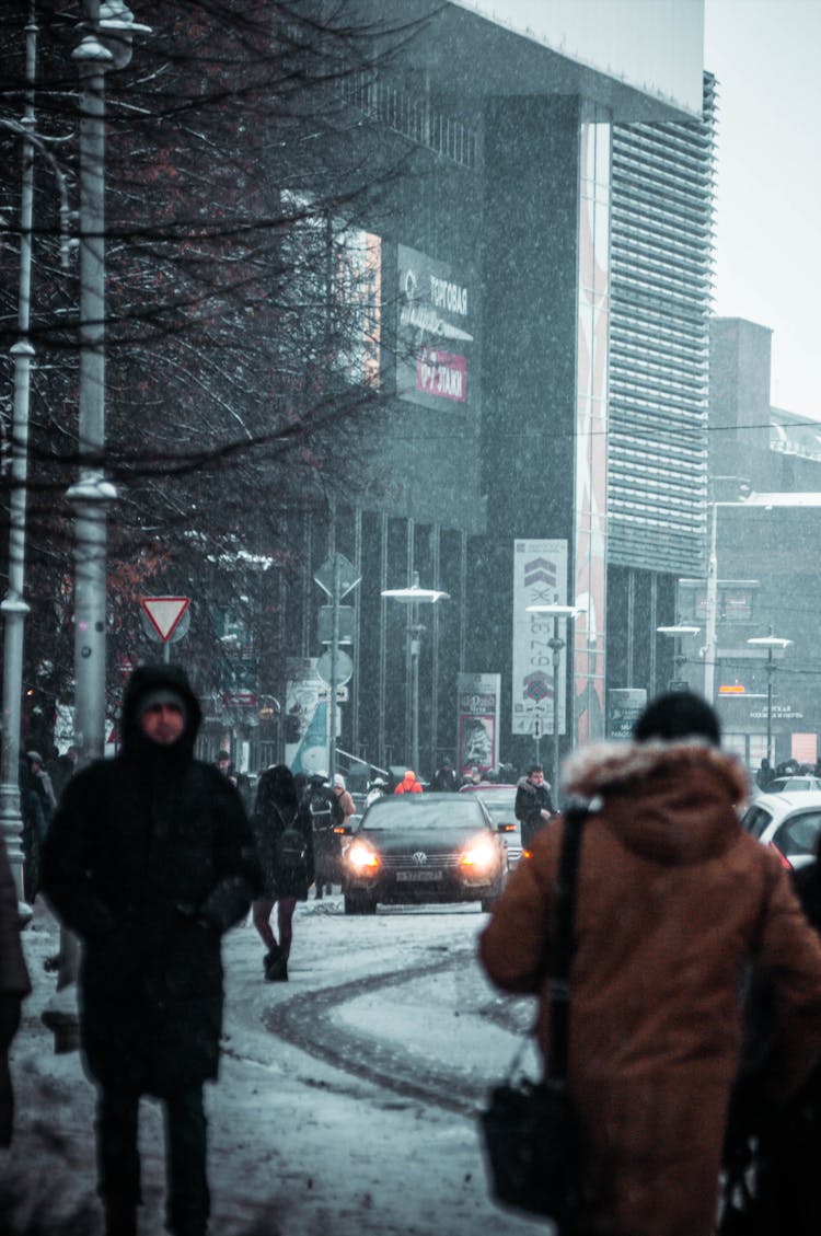 People And Car On City Street