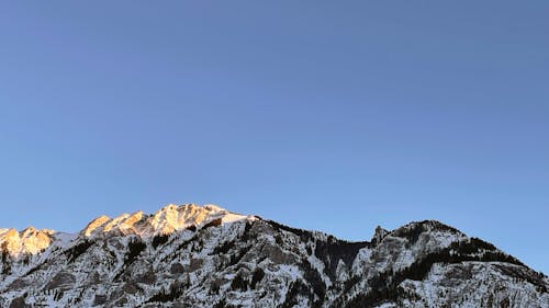 Foto profissional grátis de montanha, neve, pôr do sol