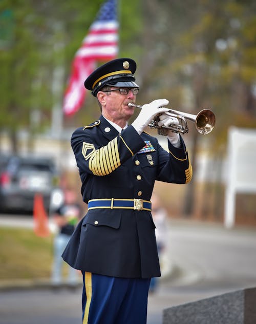 Man in Military Uniform Playing Trumpet