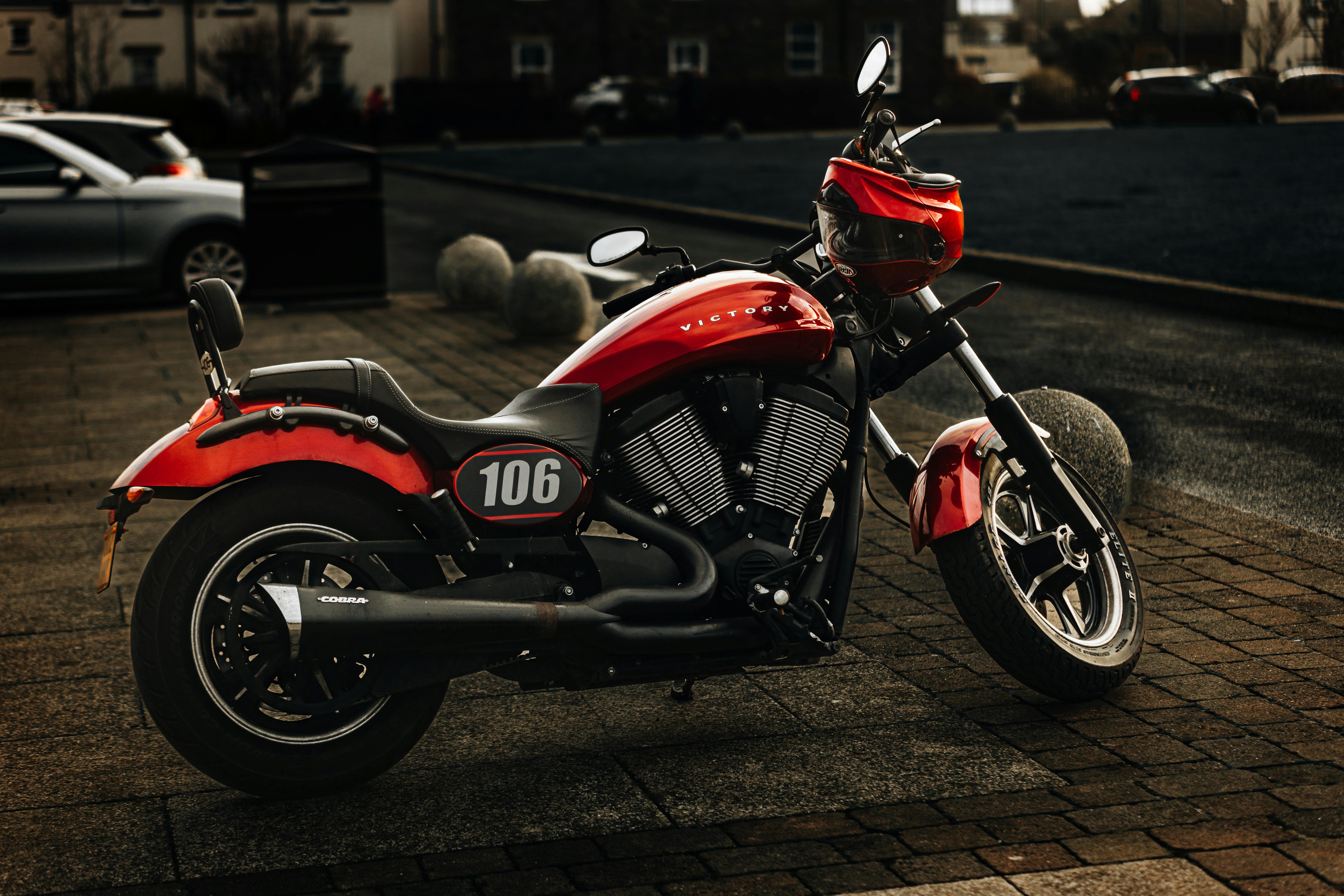 Photo of a black, white and orange motorcycle · Free Stock Photo