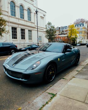 Capture of a sleek Ferrari on a stylish city street in Mayfair, London, England.