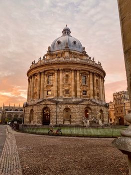 The iconic Radcliffe Camera at sunset in Oxford, capturing its stunning architecture.