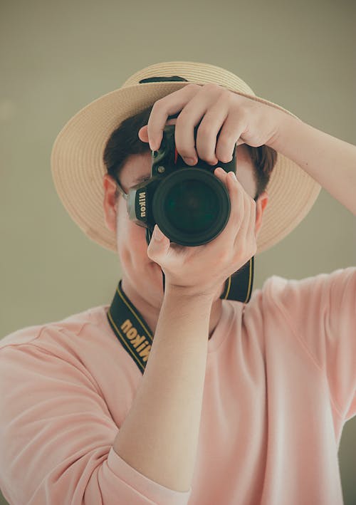 Man Holding Nikon Dslr Camera