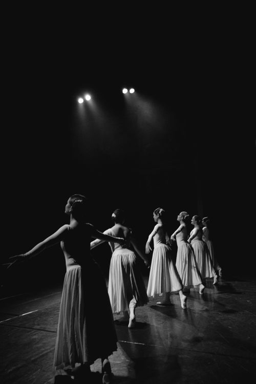 Free A captivating black and white image of ballerinas gracefully performing on stage. Stock Photo