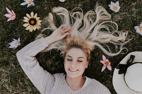 Free Woman Lying on Flowers Stock Photo