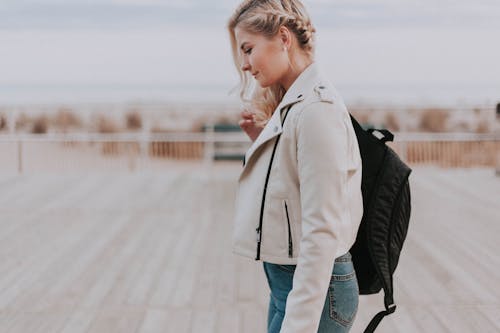 Free Woman in Black Zip-up Jacket With Black Backpack Stock Photo