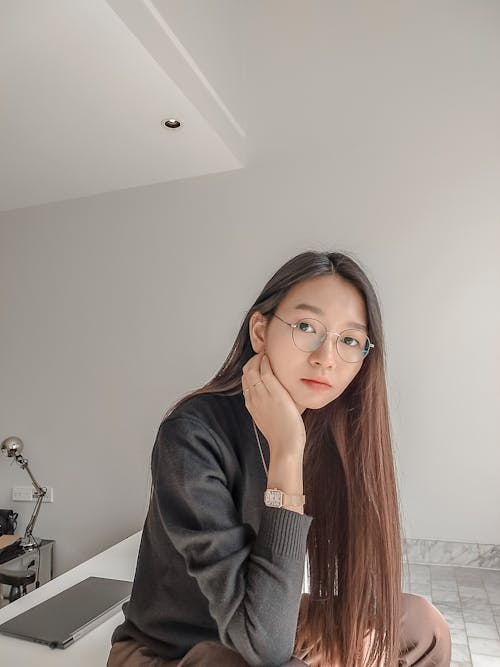 Portrait of Beautiful Woman Wearing Wristwatch and Sweater