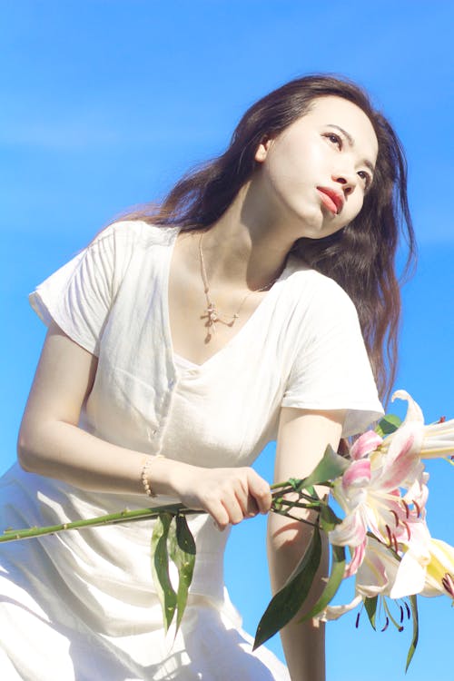 Attractive Woman Holding Flowers